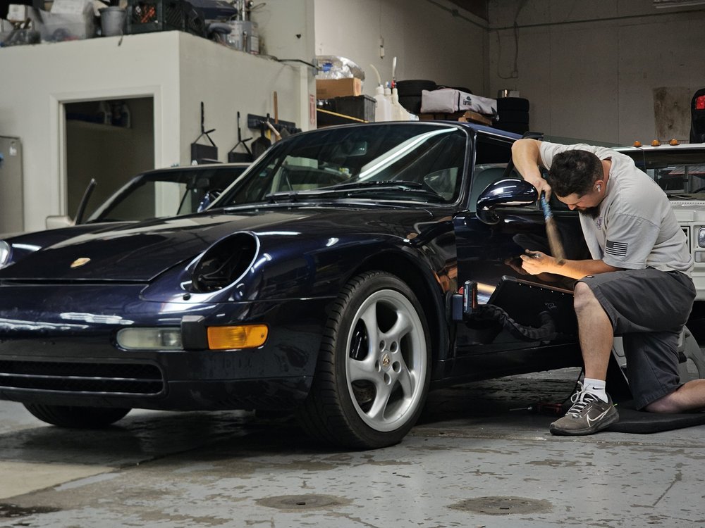 Paintless dent removal in progress